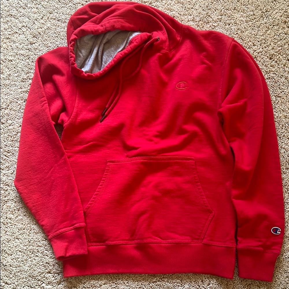 Champion Red hoodie with drawstrings and large front pocket in size small.